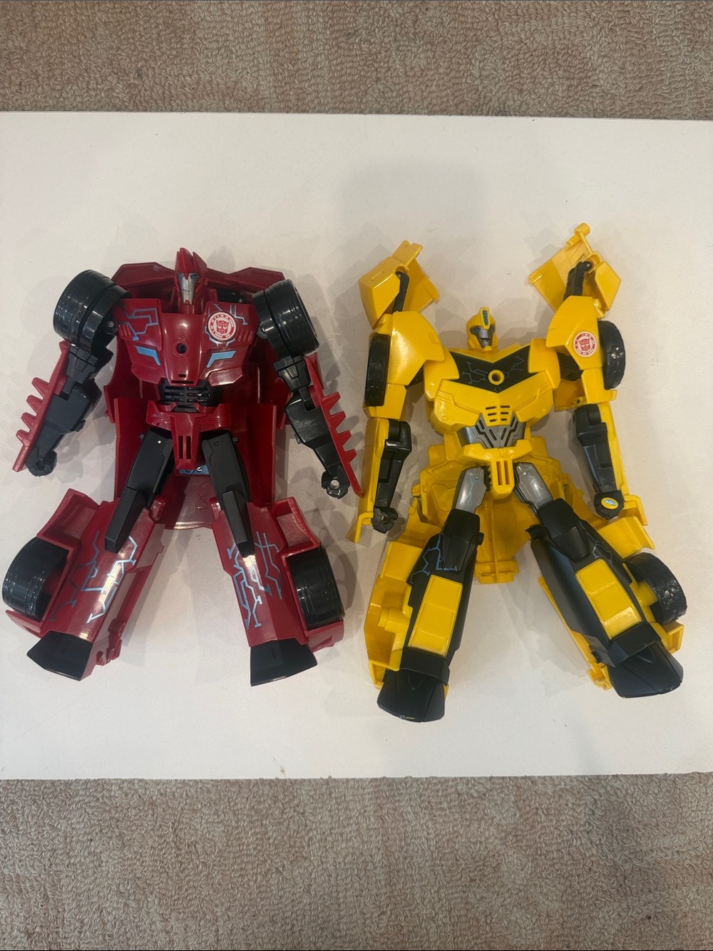 Hasbro Yellow Bumblebee and Red Dino Mirage Light Up Talking transformers Set